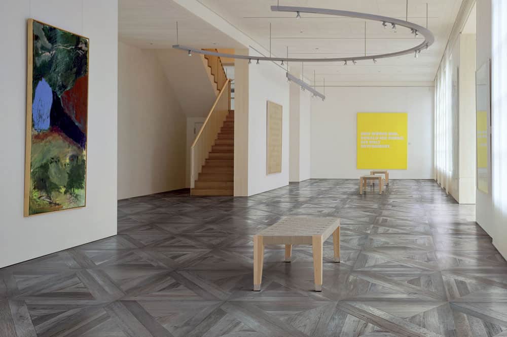 Inspiration image of a room with custom tile flooring
